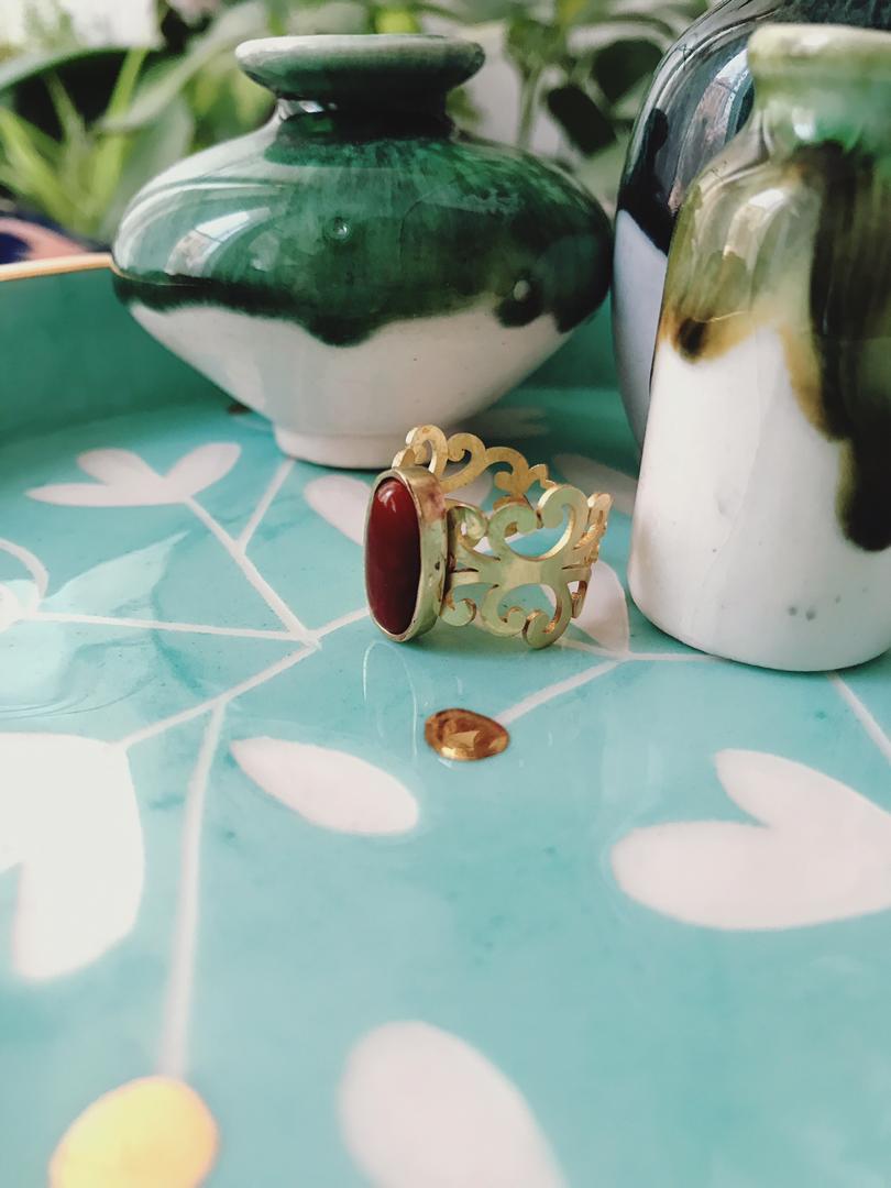 Brass ring and dark red agate