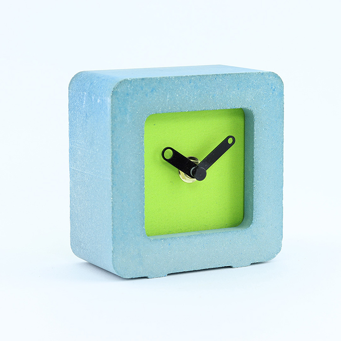 Blue concrete desktop handmade watch with bubble brand green background