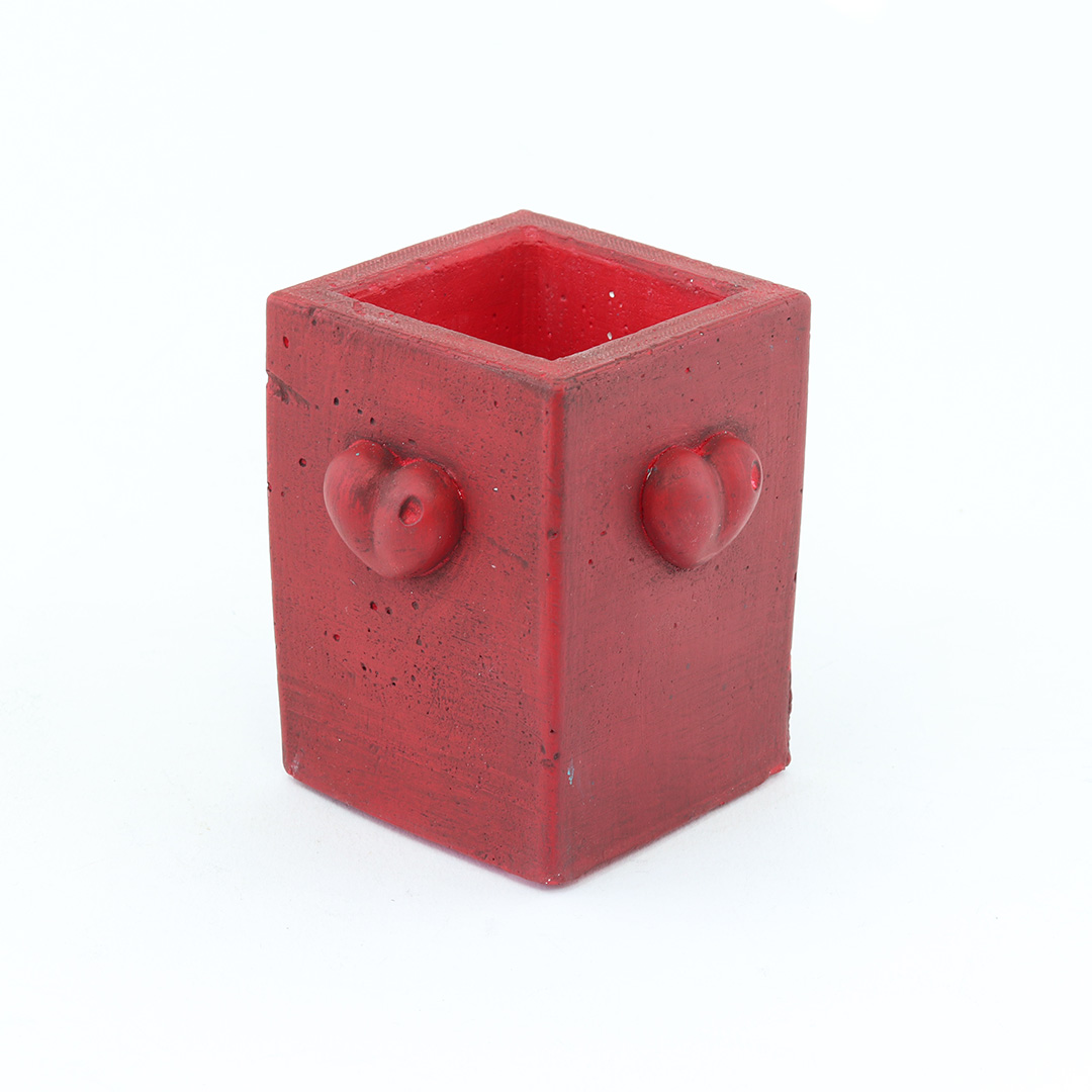 Handmade concrete pot with red heart d20