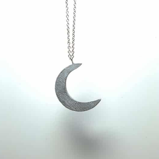 Concrete necklace with crescent moon design
