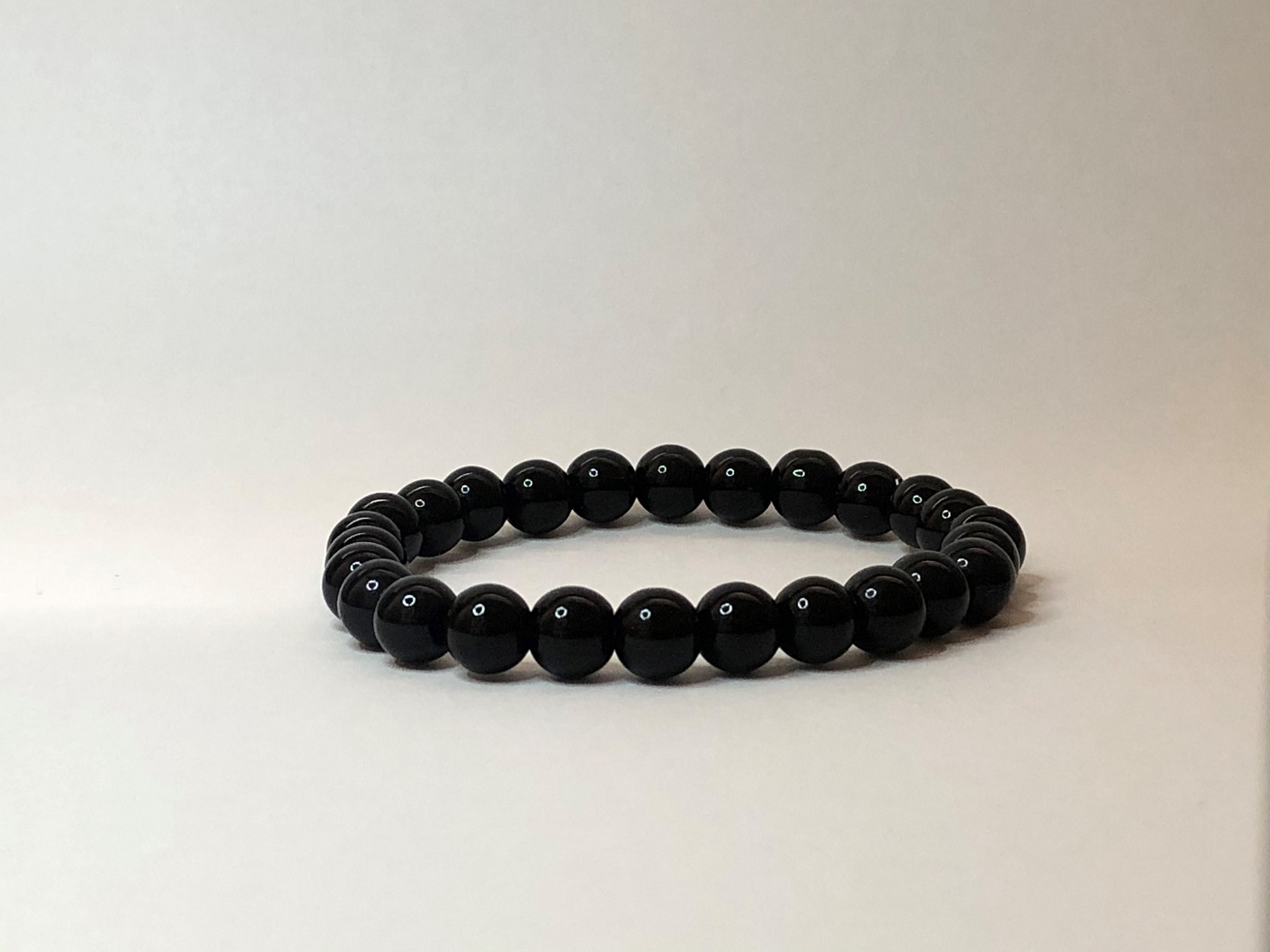 Glossy black onyx ball bracelet