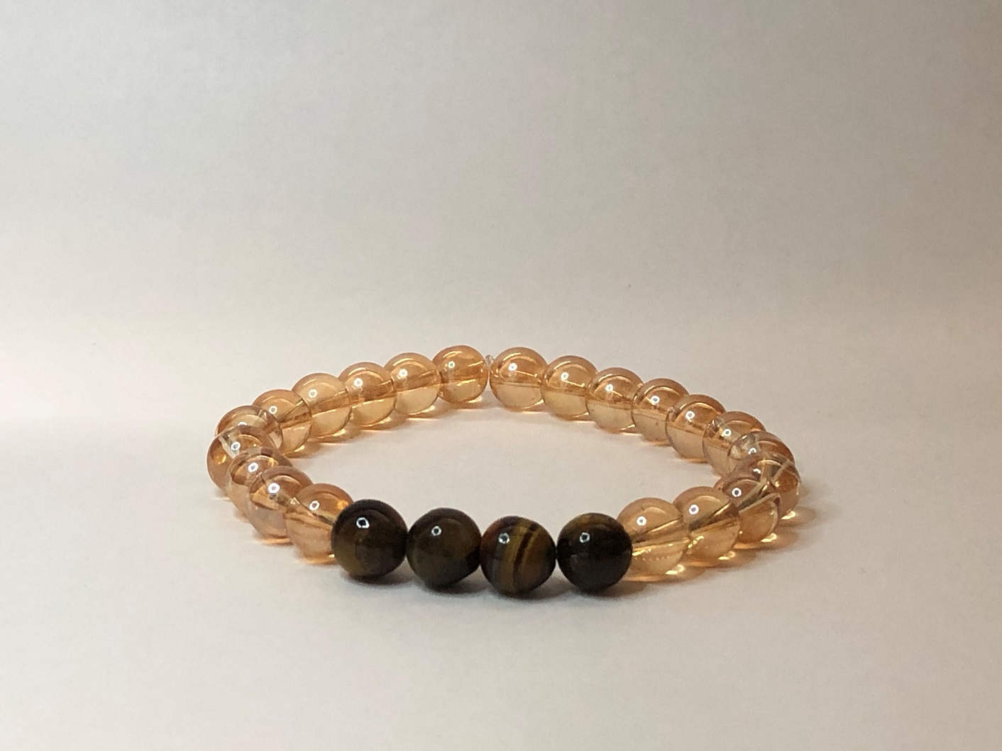 Golden onyx ball bracelet with tiger eyes