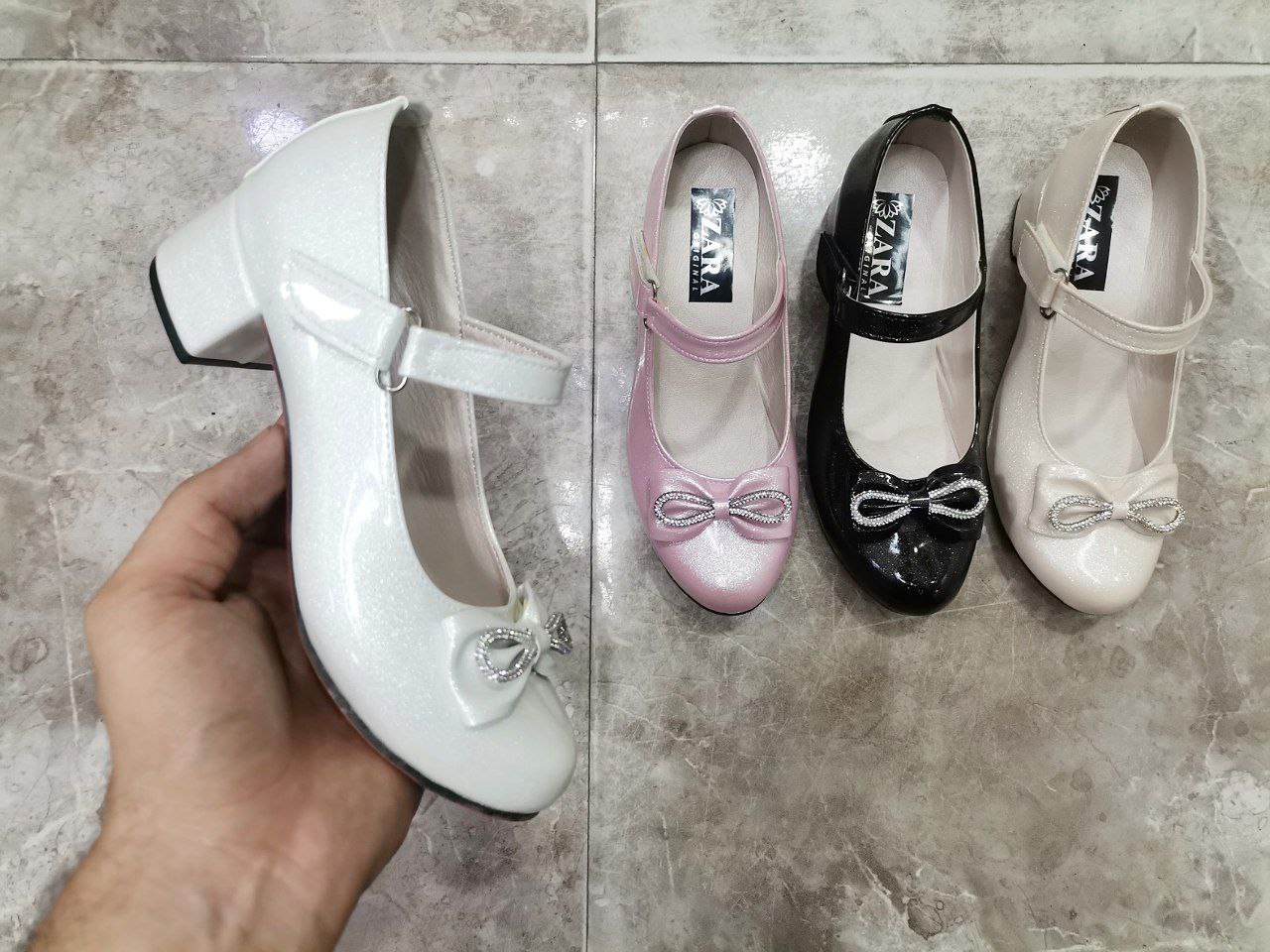 خرید عمده کفش دخترانه پاشنه دار سایز 31_36  دارای رنگ بندی