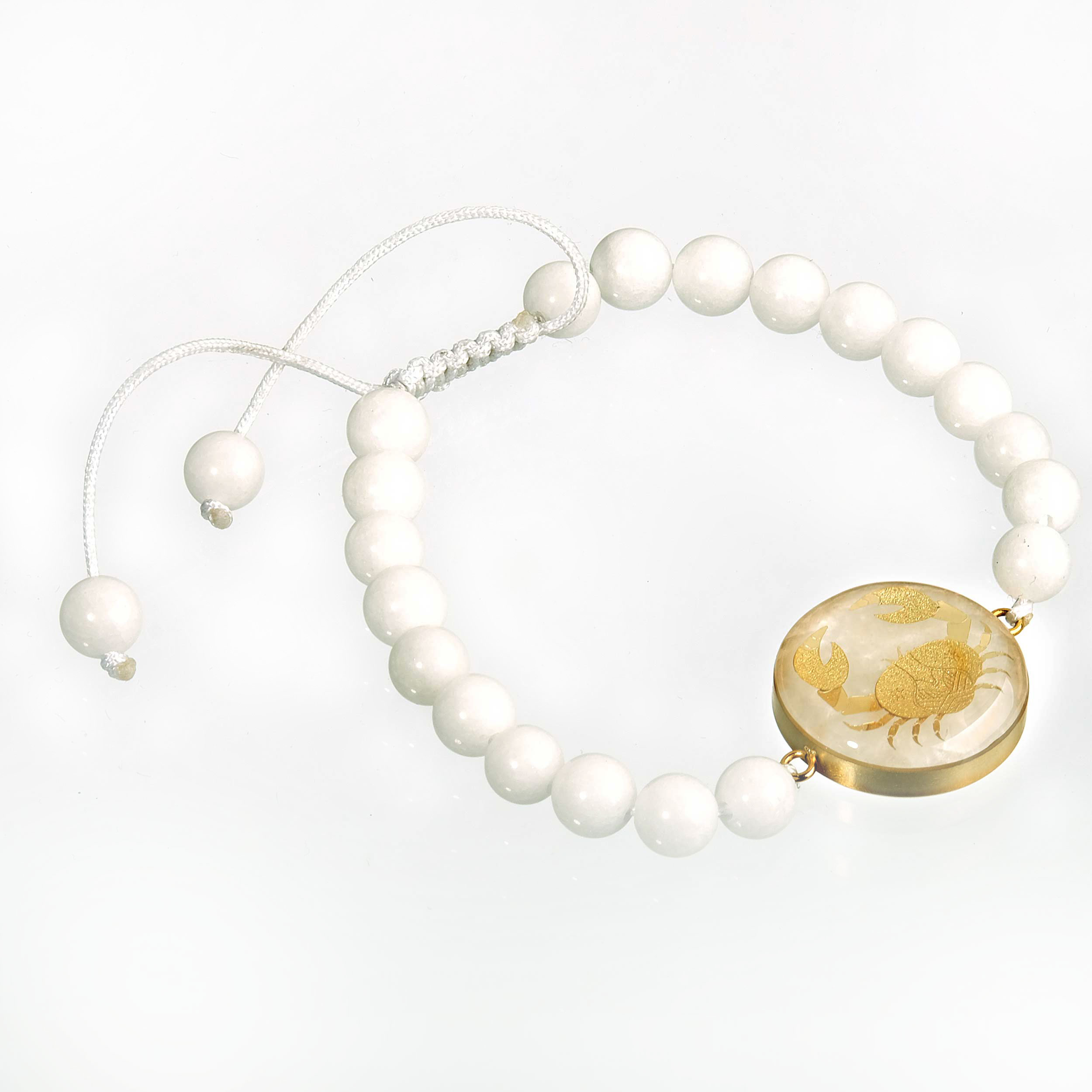 دستبند سنگ صدف و ورق طلای 24 عیار با طرح سمبل ماه تیر